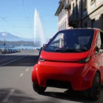 Voiture sans permis devant le jet d'eau de Genève